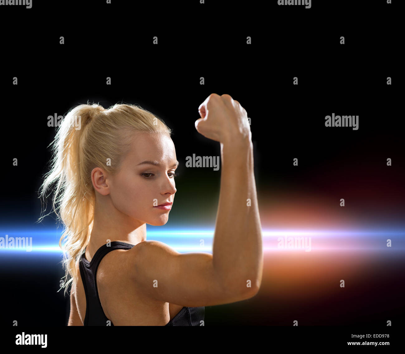 close up of athletic woman flexing her biceps Stock Photo - Alamy