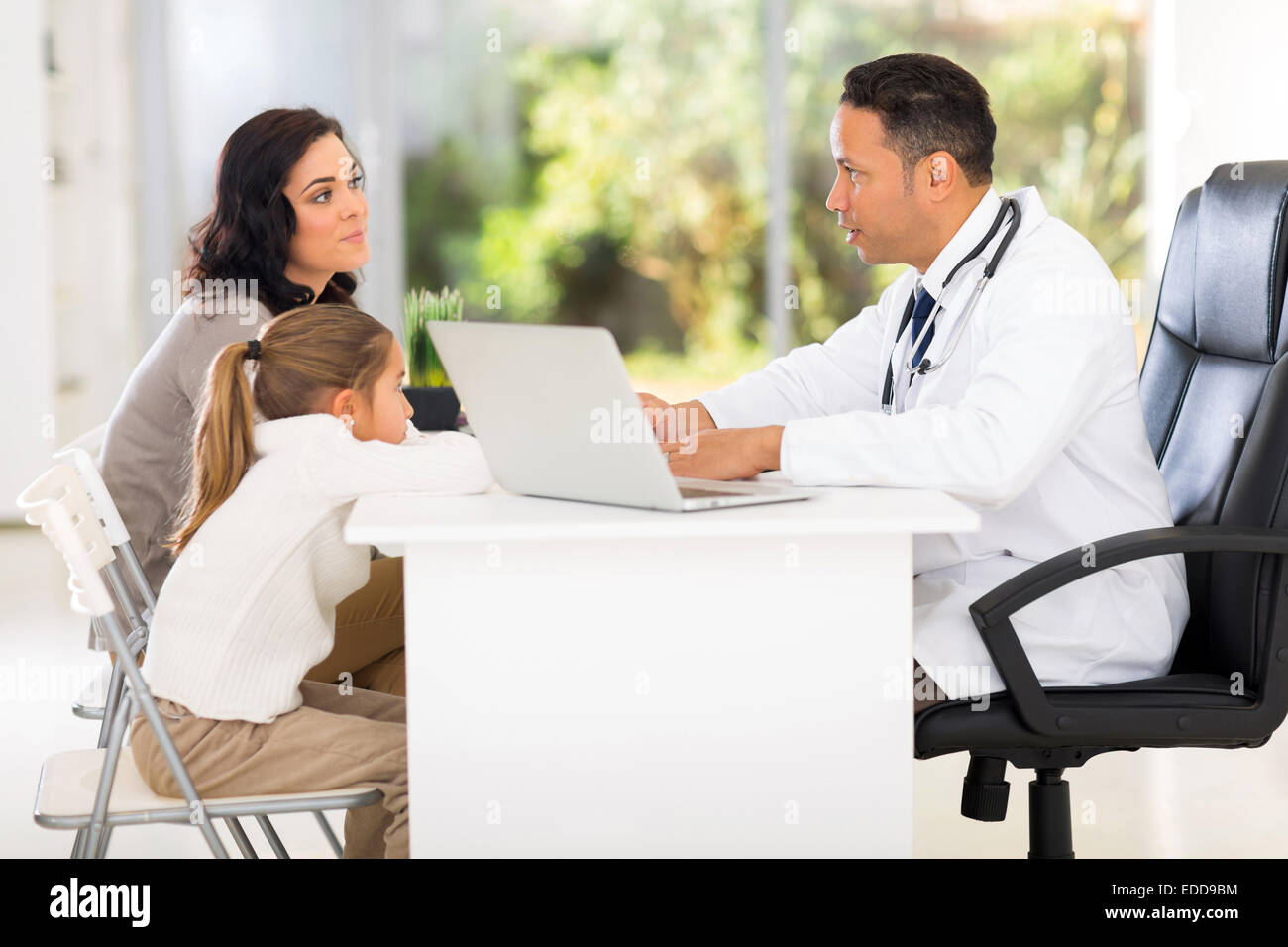 pediatric doctor talking to patient's mother Stock Photo
