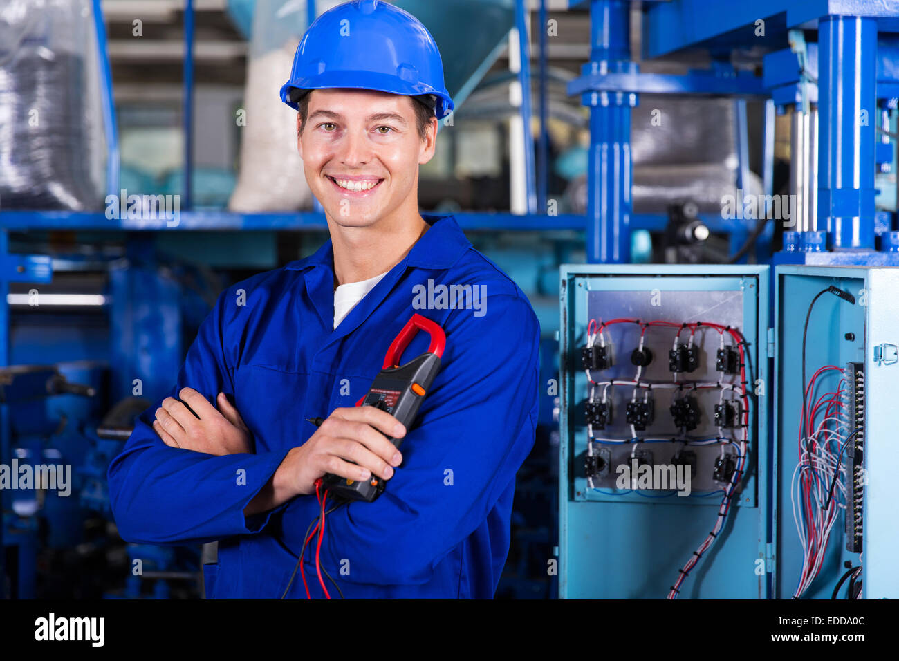 cheerful young industrial technician looking at the camera Stock Photo