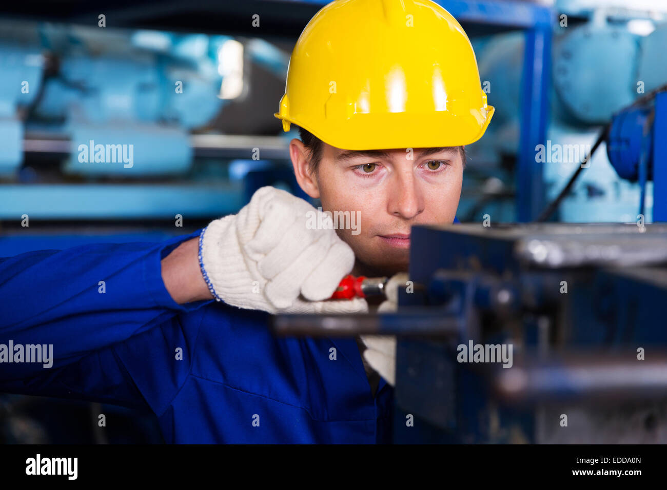 professional mechanic working in factory Stock Photo