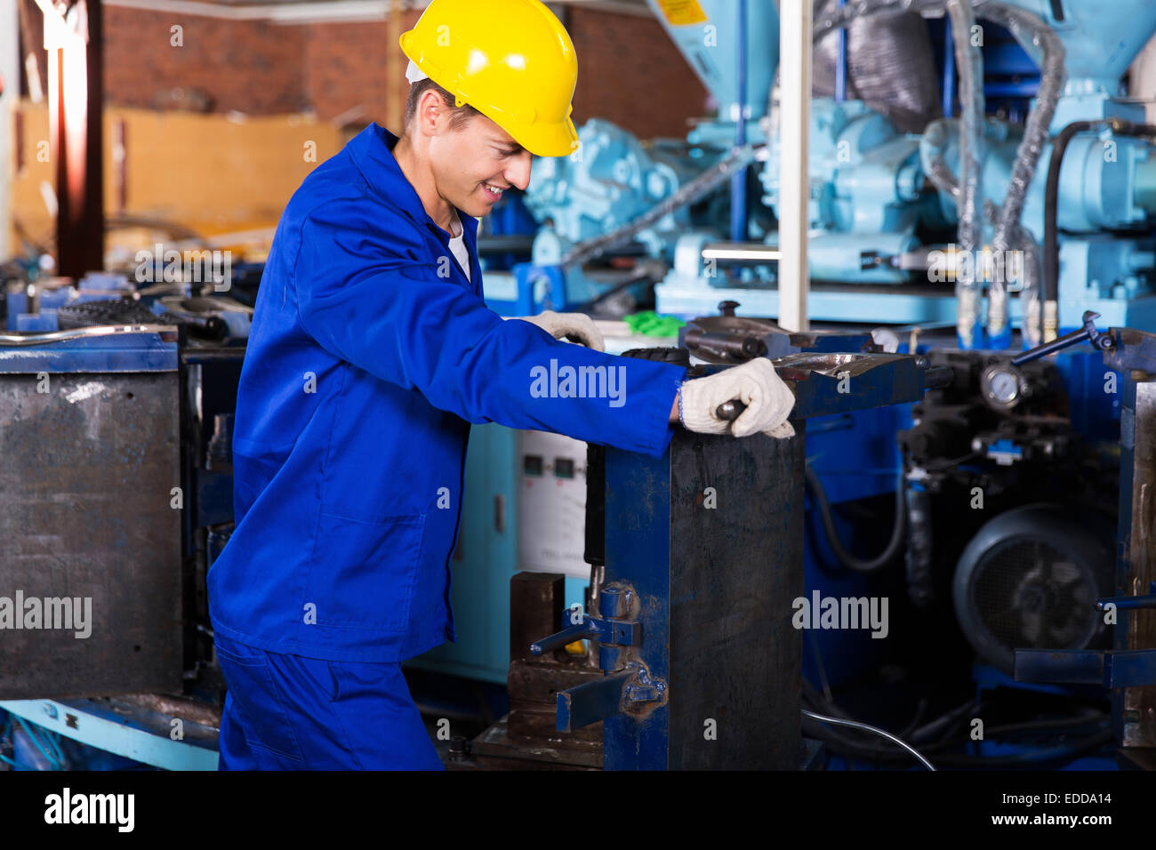 experienced factory worker working in gum boot factory Stock Photo