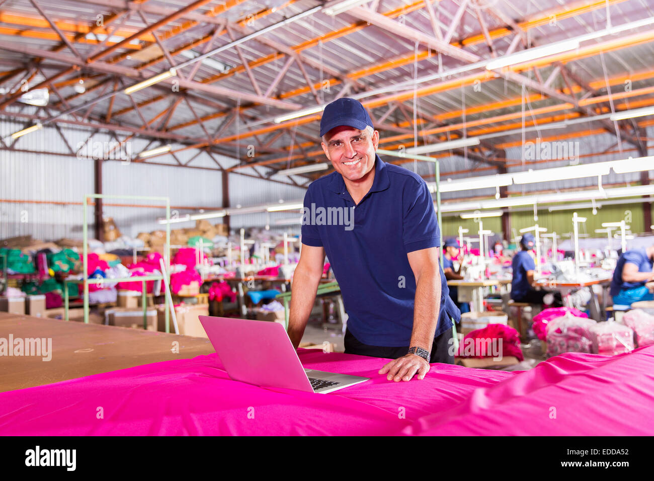 Employee at work computer manufacture hires stock photography and