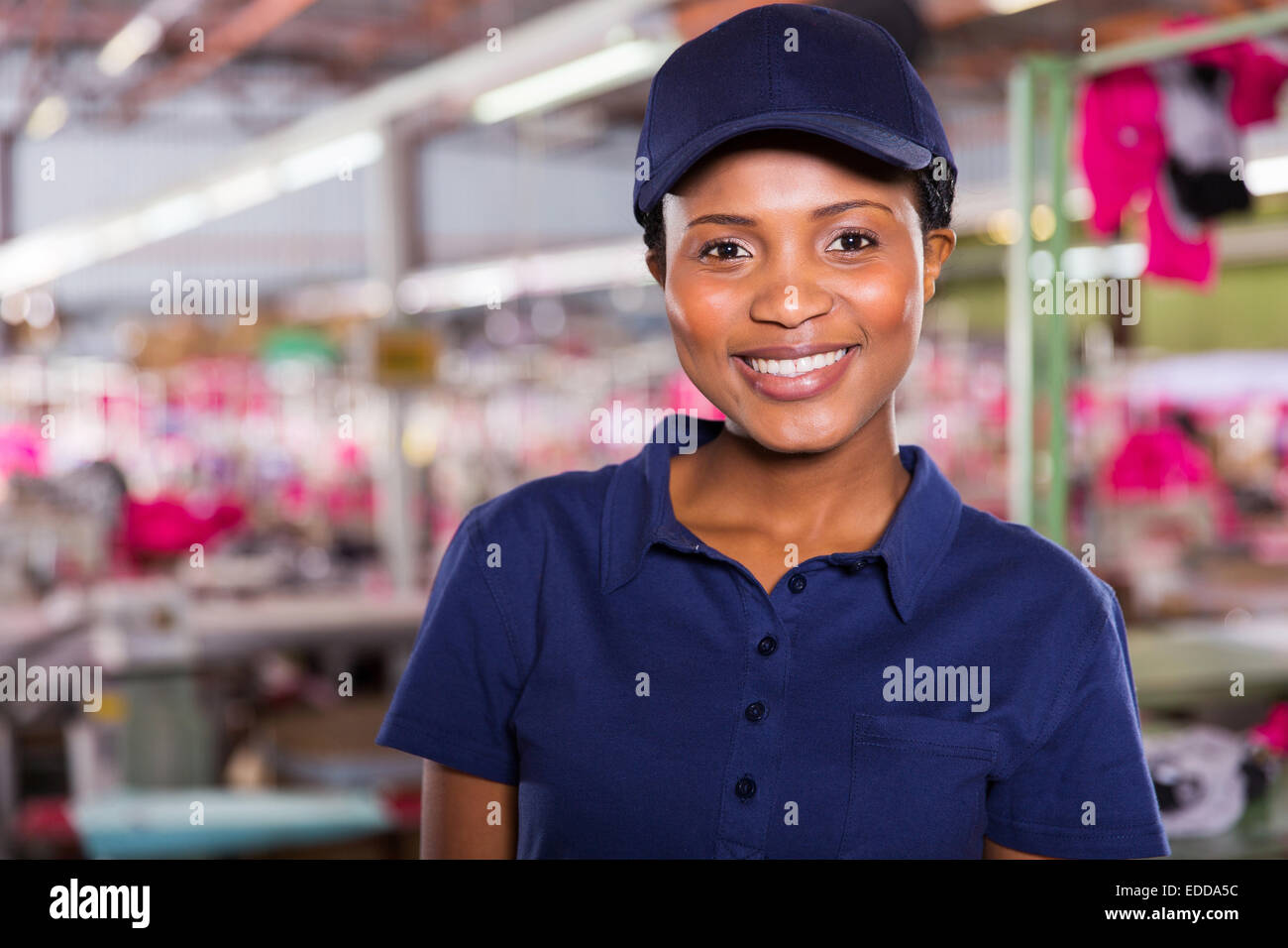 portrait of happy female clothing factory worker Stock Photo
