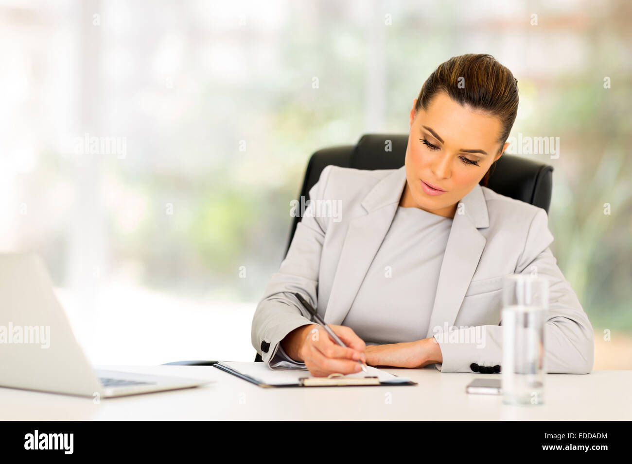 busy businesswoman working in modern office Stock Photo