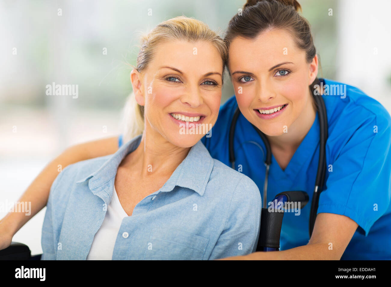 portrait of pretty senior disabled woman and her caregiver Stock Photo