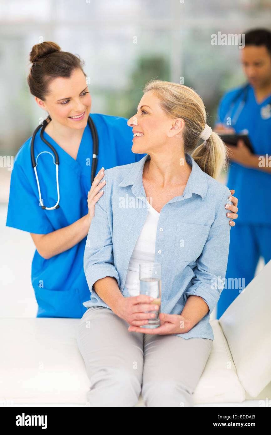 happy senior patient talking to friendly female nurse Stock Photo - Alamy