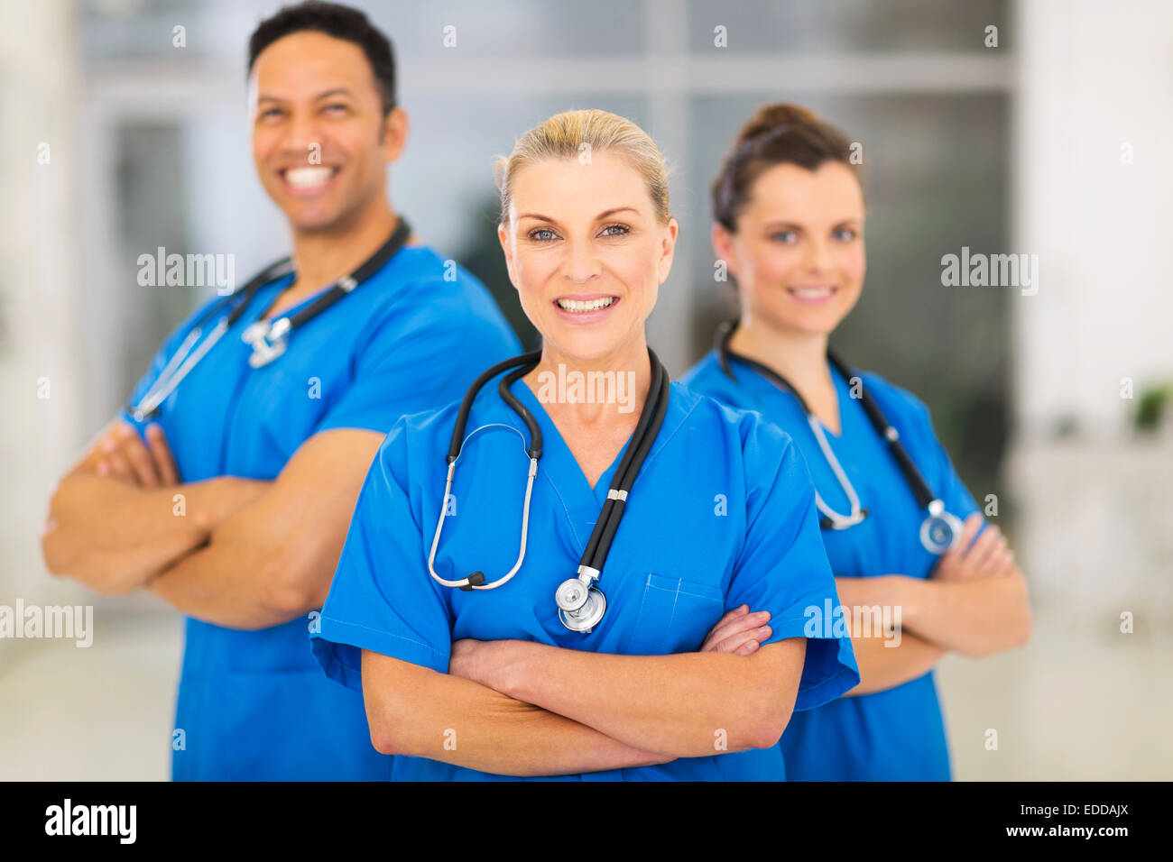 attractive senior female doctor leading medical team at hospital Stock Photo