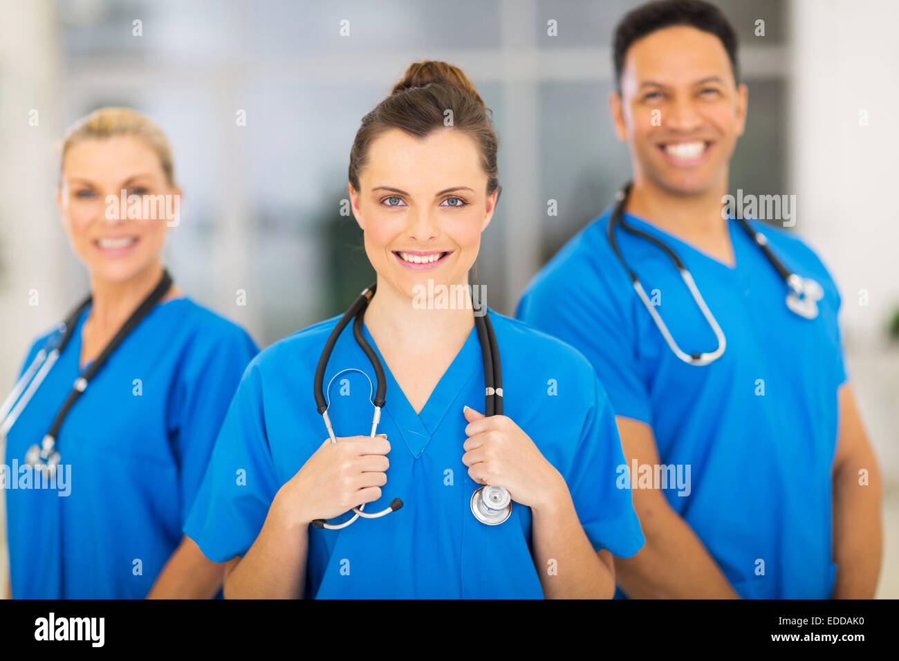 attractive medical nurse and colleagues in hospital Stock Photo