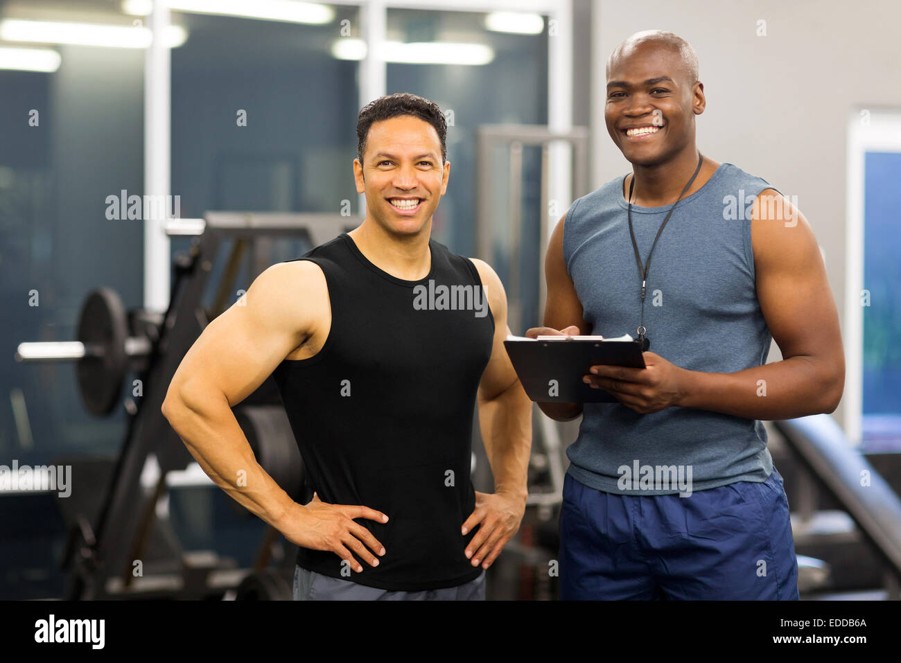 https://c8.alamy.com/comp/EDDB6A/portrait-of-african-american-fitness-instructor-with-client-EDDB6A.jpg