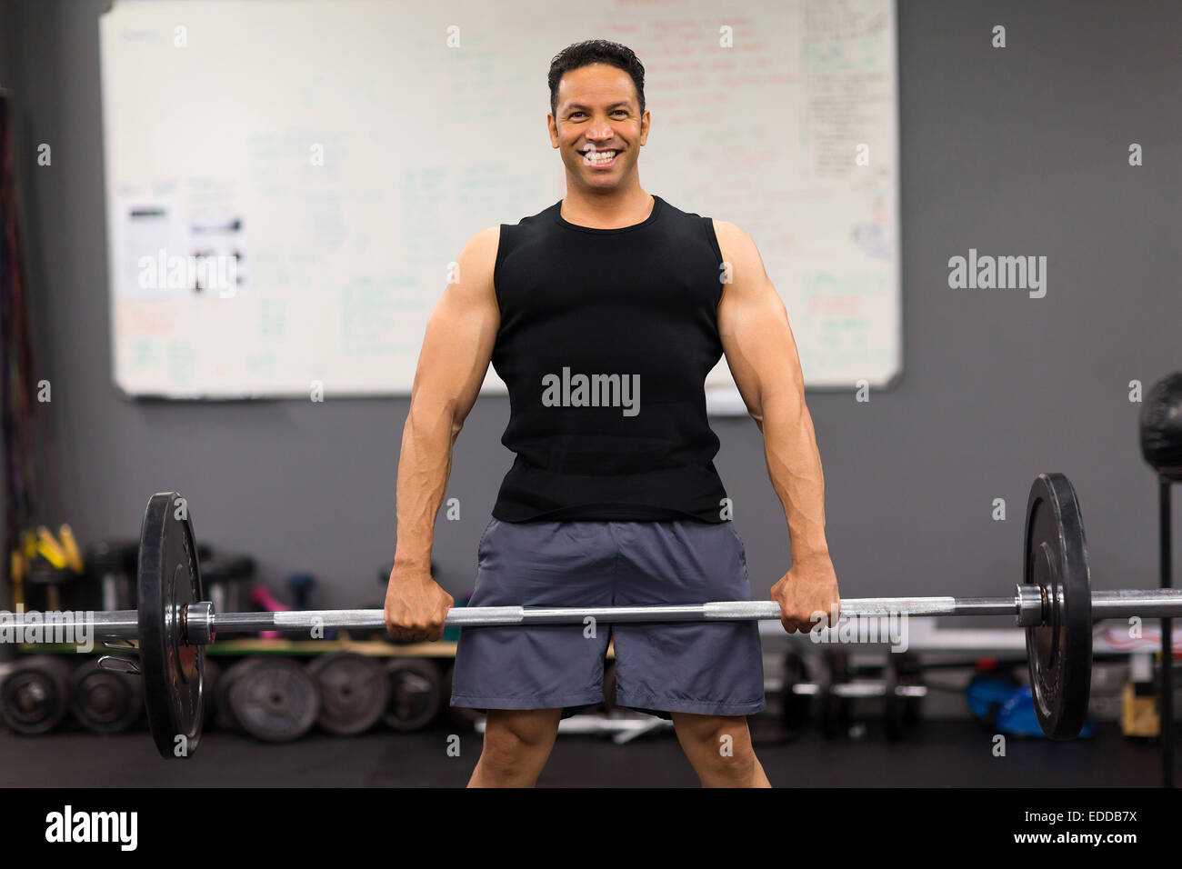Middle Bodybuilder middle aged male bodybuilder exercising with a barbell Stock Photo - Alamy