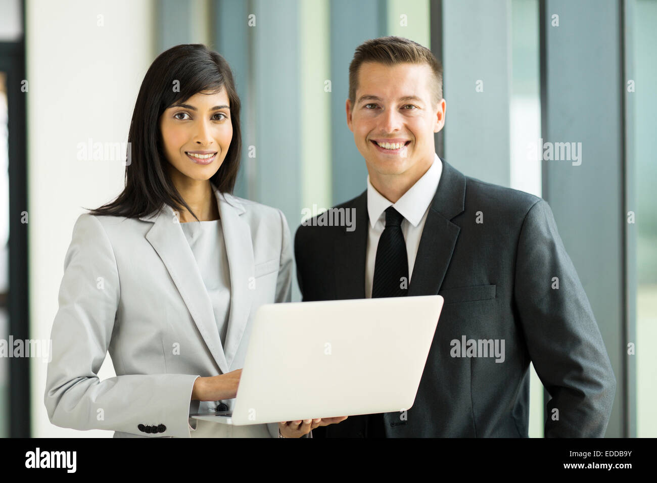 portrait of successful young business executive in modern office Stock Photo