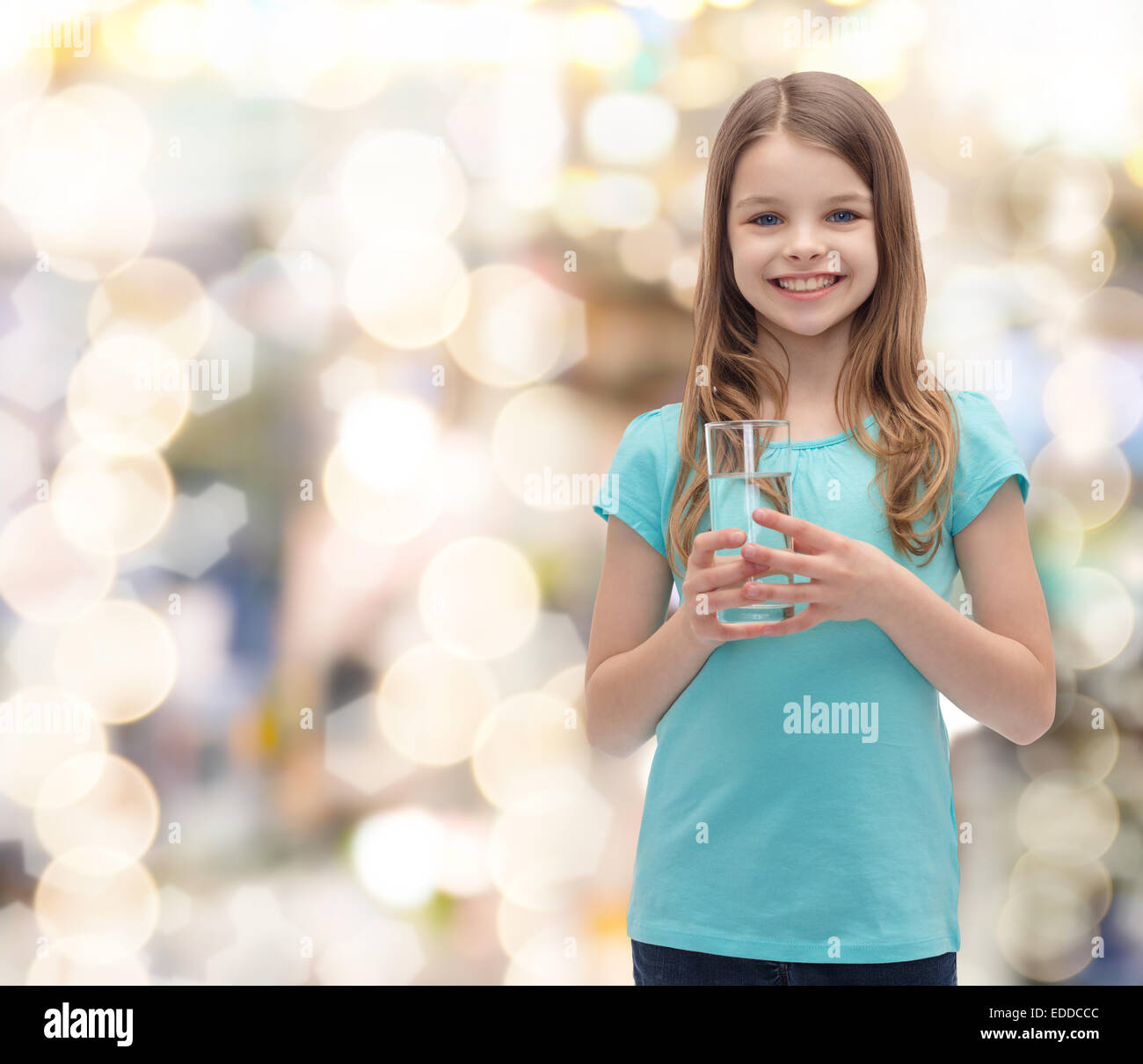 smiling little girl with glass of water Stock Photo - Alamy
