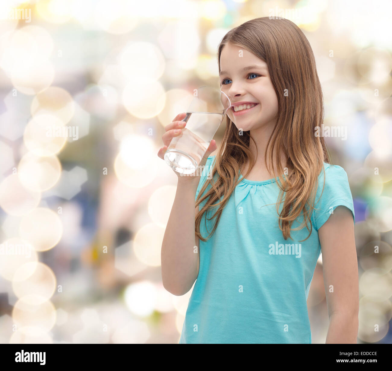 smiling little girl with glass of water Stock Photo - Alamy