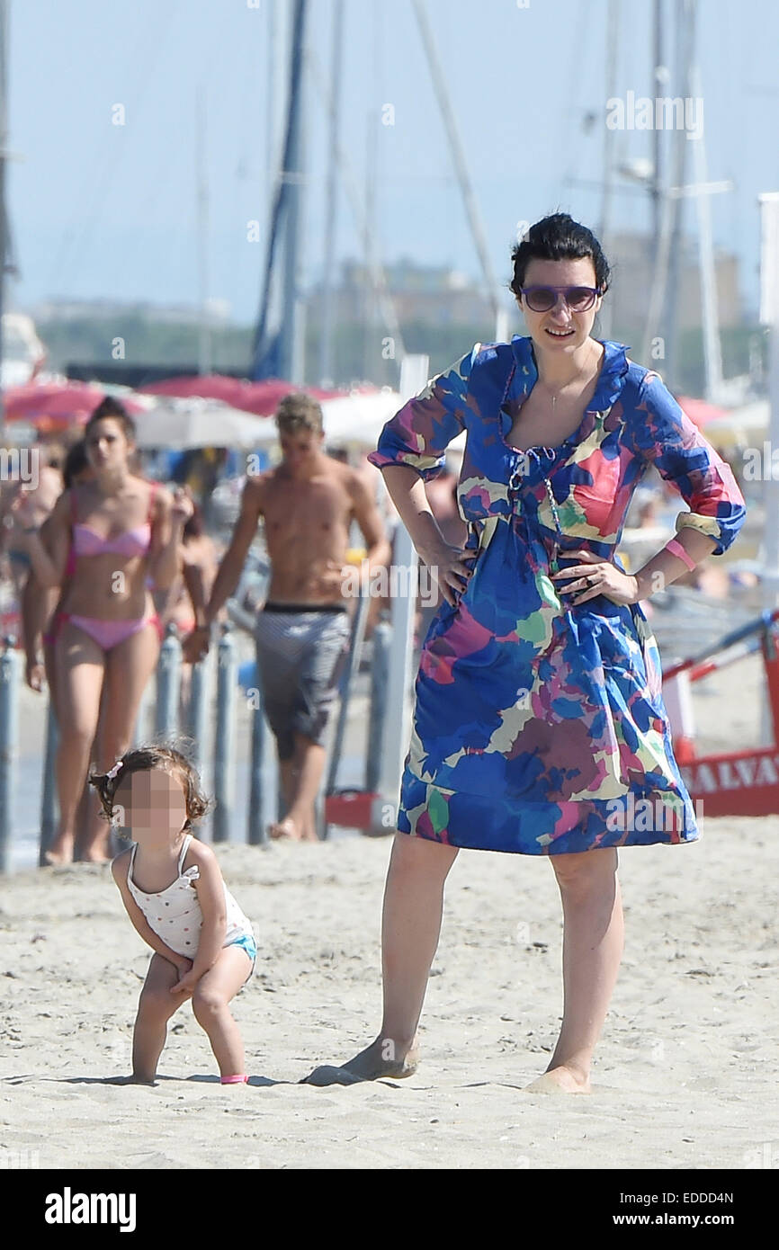 Italian pop singer and record producer Laura Pausini enjoys a day on the  beach with her daughter Paola and family in Milano Marittima, Italy  Featuring: Laura Pausini Where: Milano Marittima, Italy When: