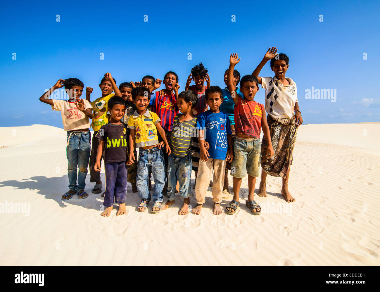 Young Socotrian boys posing in the sand dunes at the south coast of the island of Socotra, Yemen Stock Photo