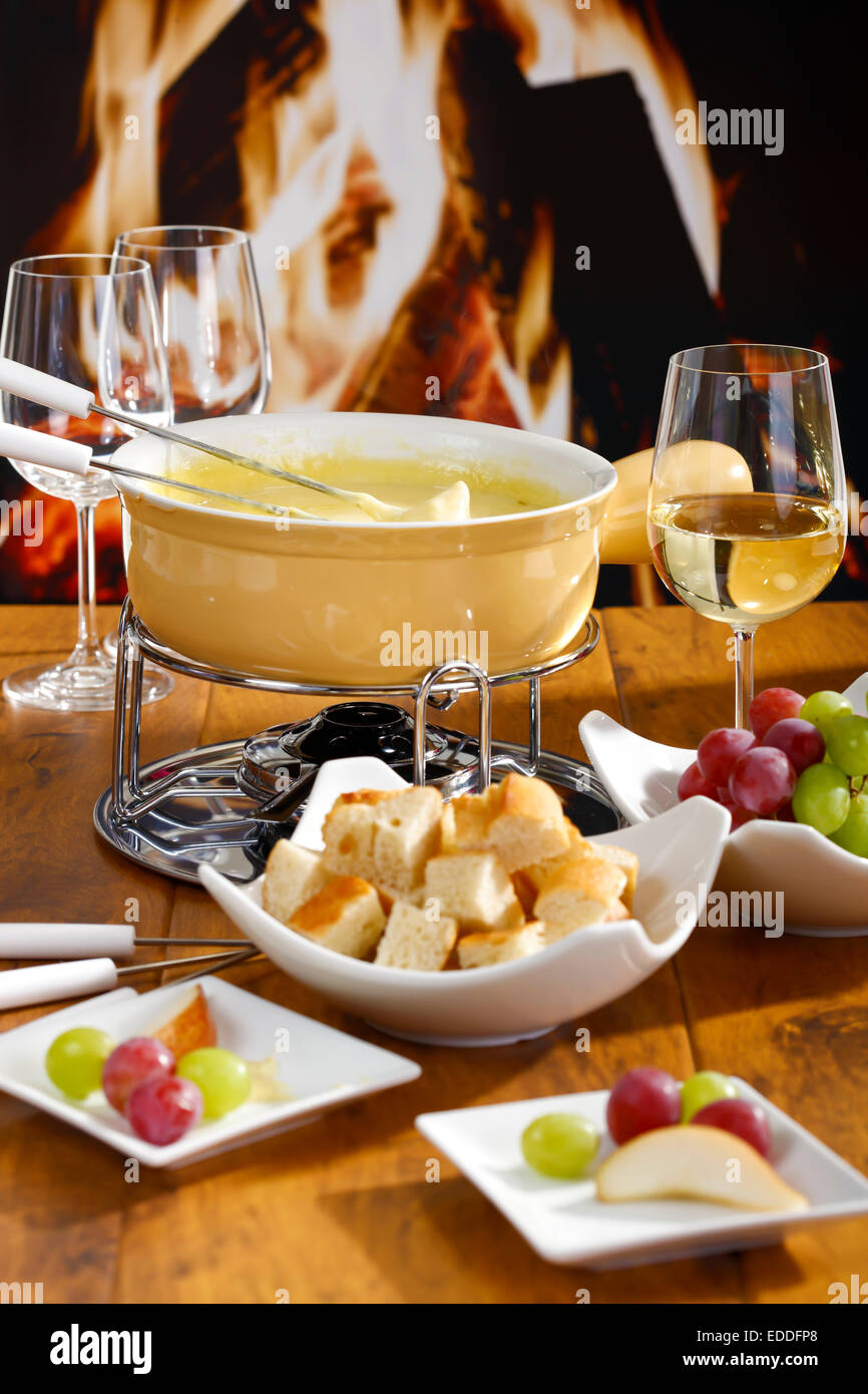 Cheese fondue with bread and grapes Stock Photo Alamy