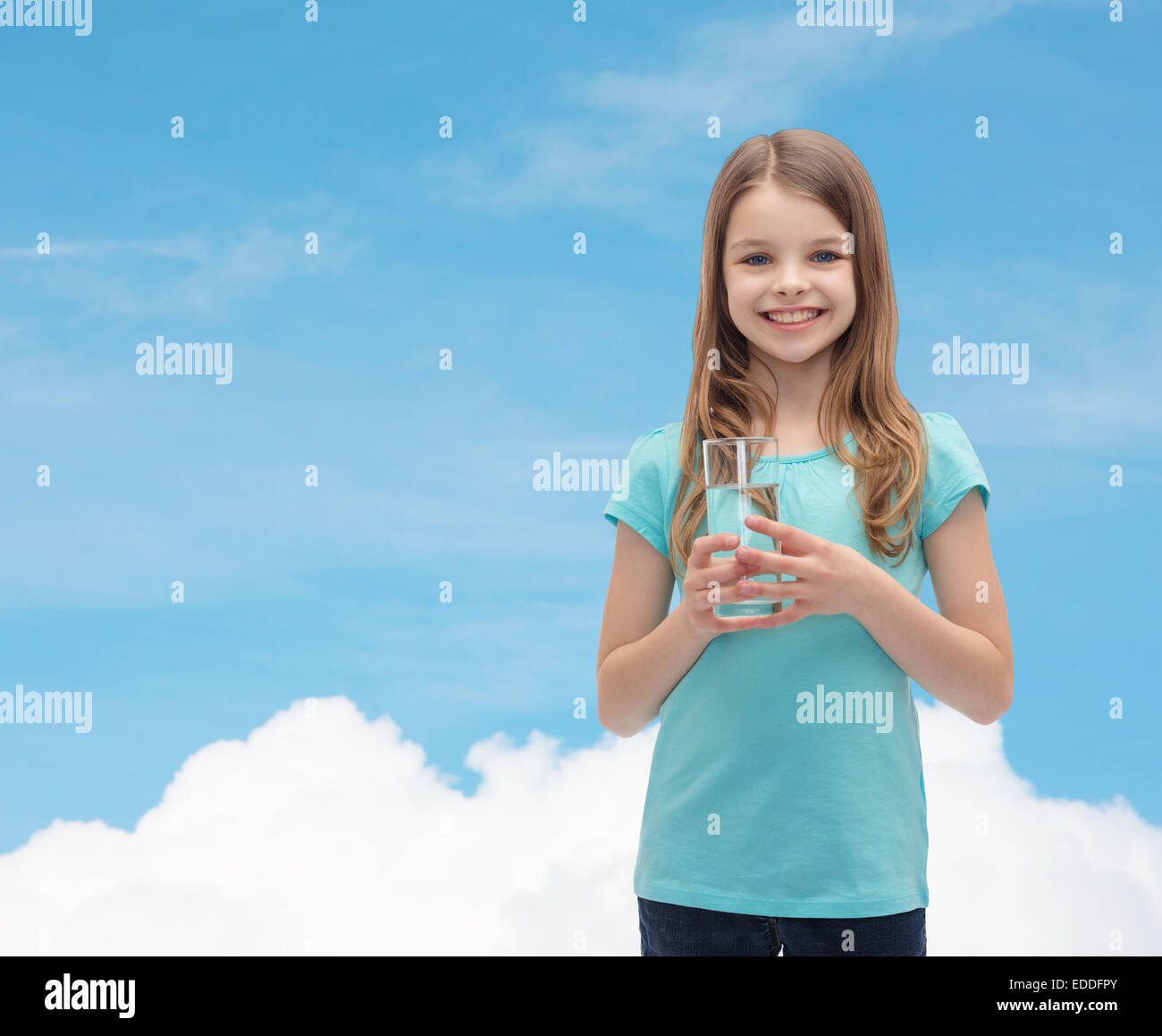 smiling little girl with glass of water Stock Photo - Alamy