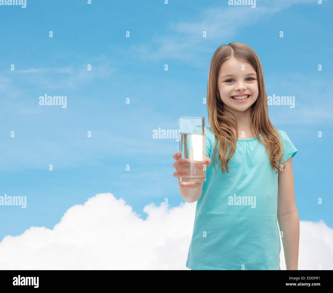 smiling little girl giving glass of water Stock Photo - Alamy