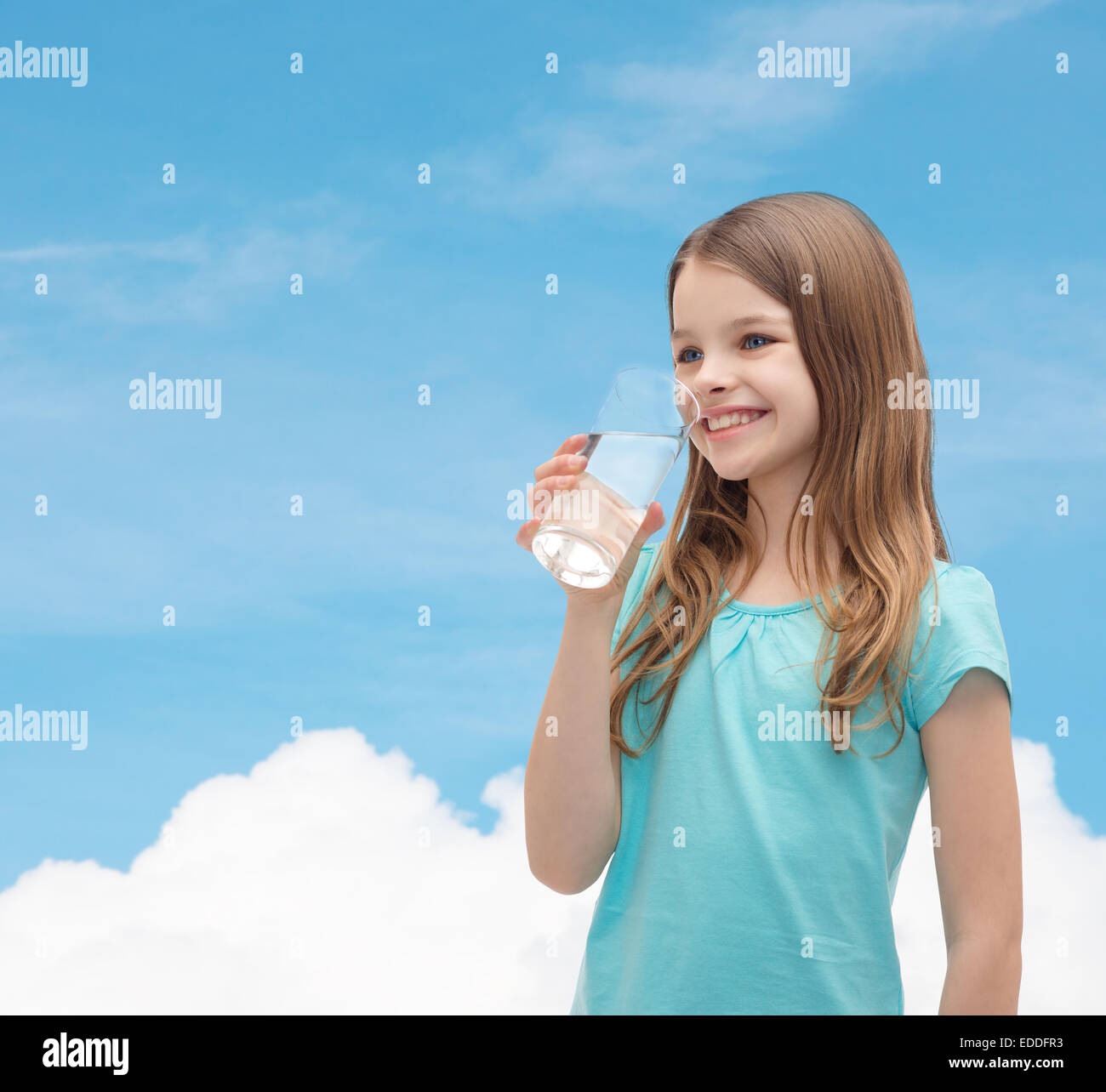 smiling little girl with glass of water Stock Photo - Alamy