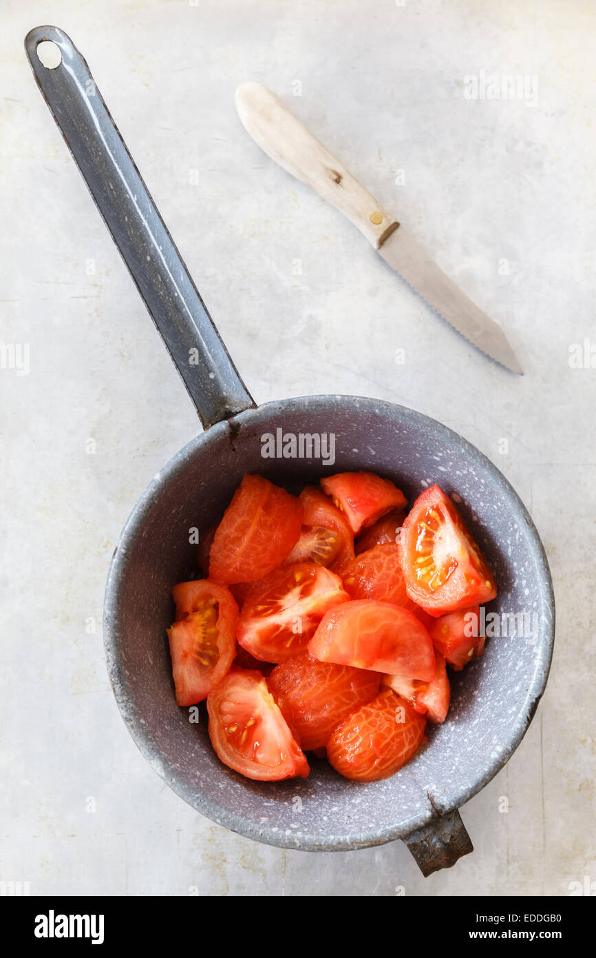 Casserole of quartered and skinned  tomatoes Stock Photo