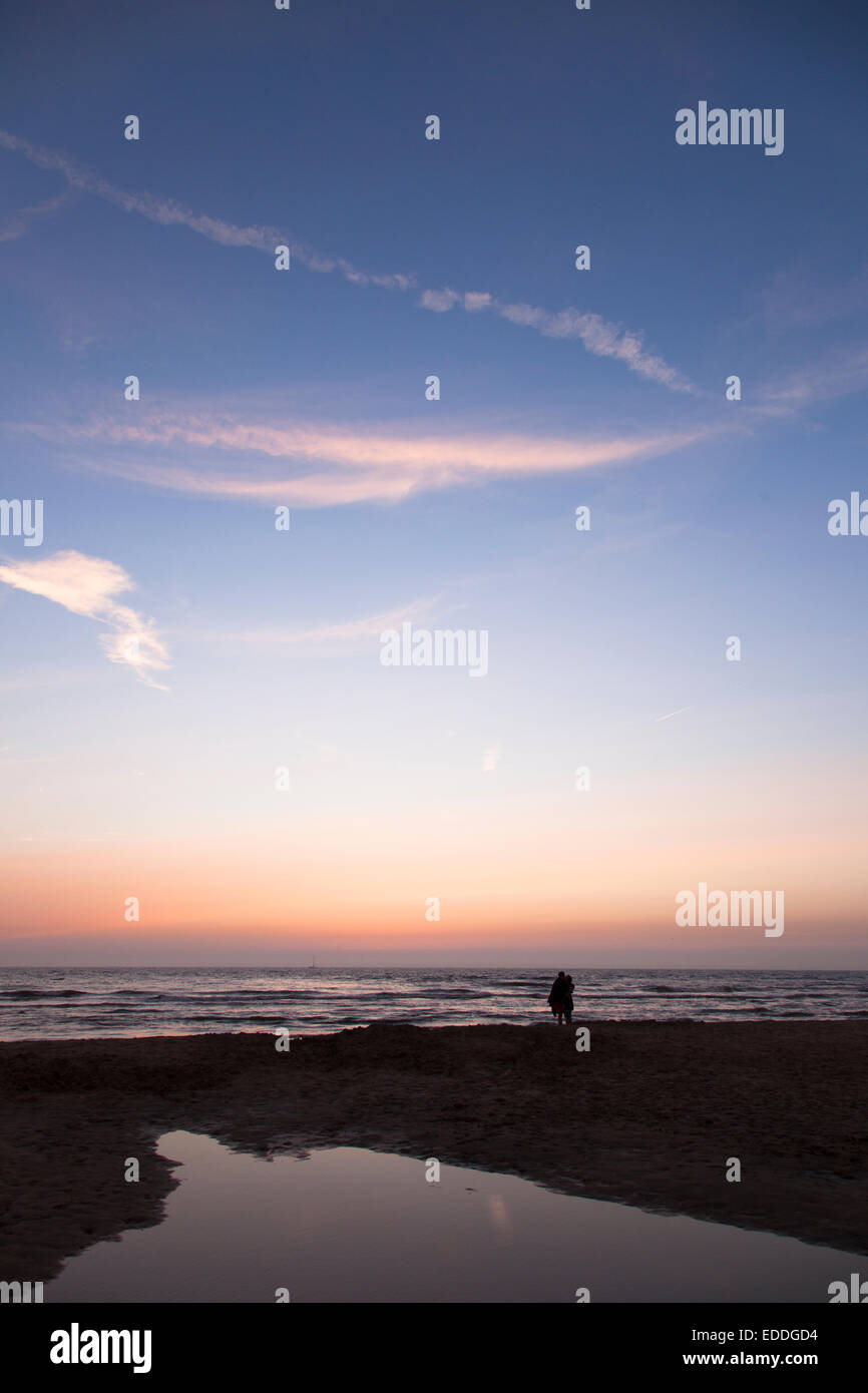Netherlands, Bloemendaal, lovers on beach at sunset Stock Photo
