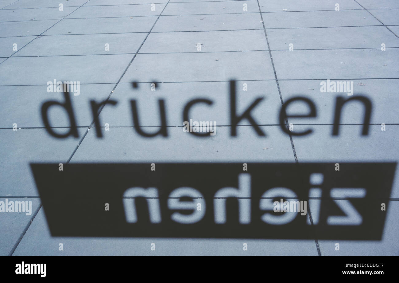 Sign at glass door Stock Photo - Alamy