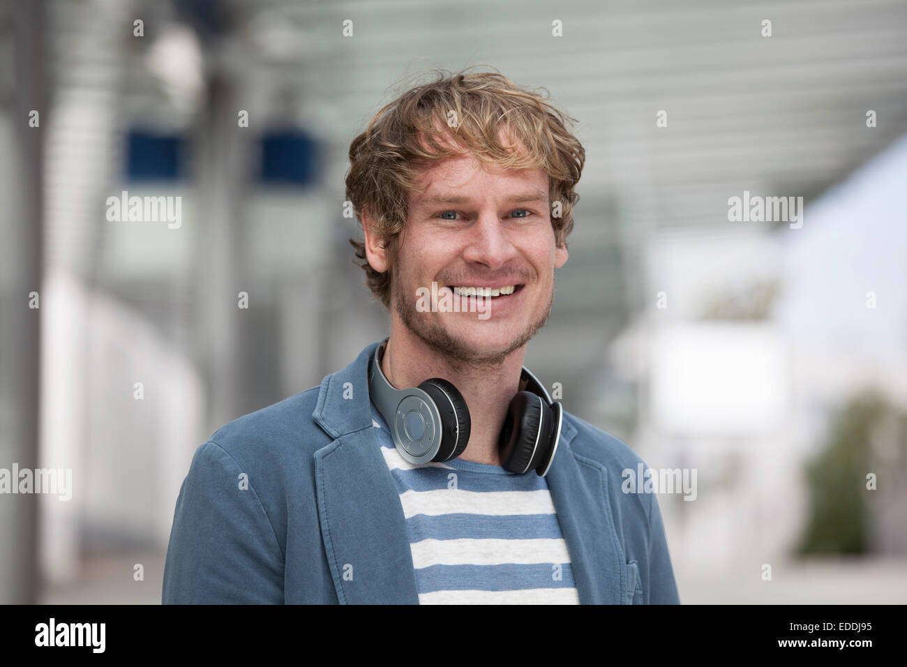 Portrait of smiling man with headphones Stock Photo