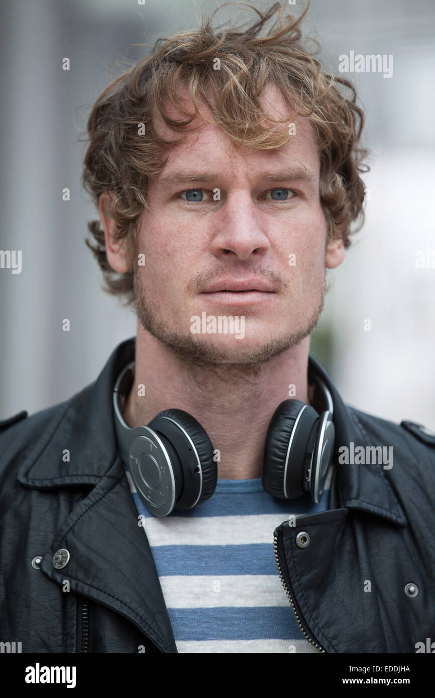 Portrait of serious looking man with headphones Stock Photo