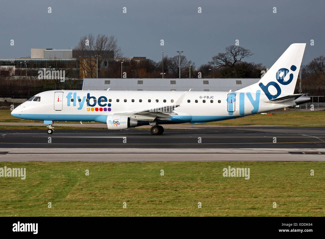 FlyBe Embraer 175 accelerates down runway 23R at Manchester airport. Stock Photo