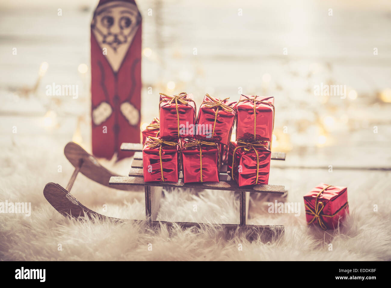 Santa Claus Figurine and miniatur sledge with little red Christmas gift ...