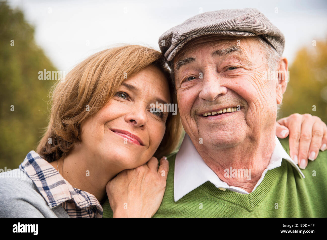 Confident senior man with daughter outdoors Stock Photo