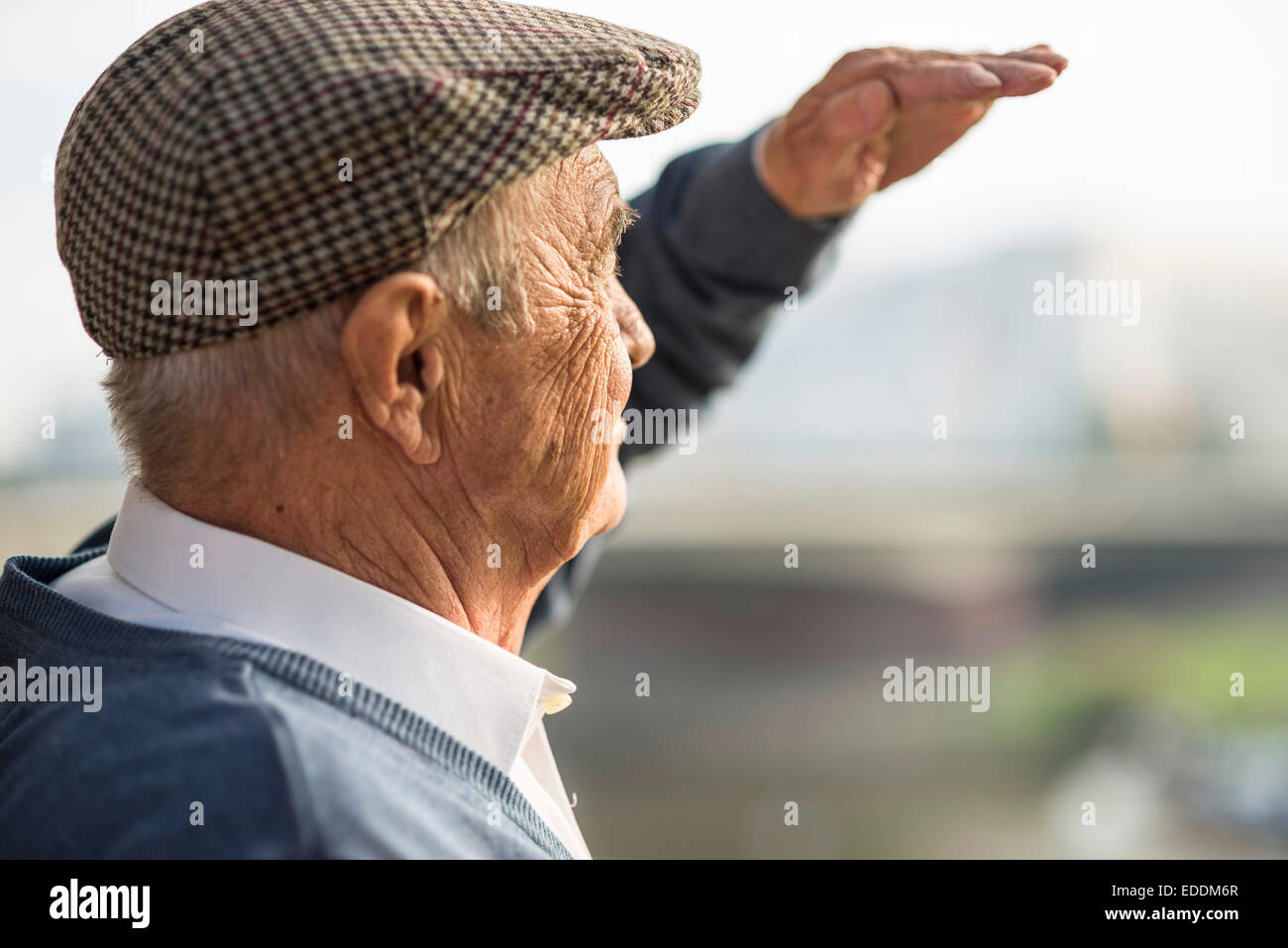 Senior man wearing cap outdoors Stock Photo