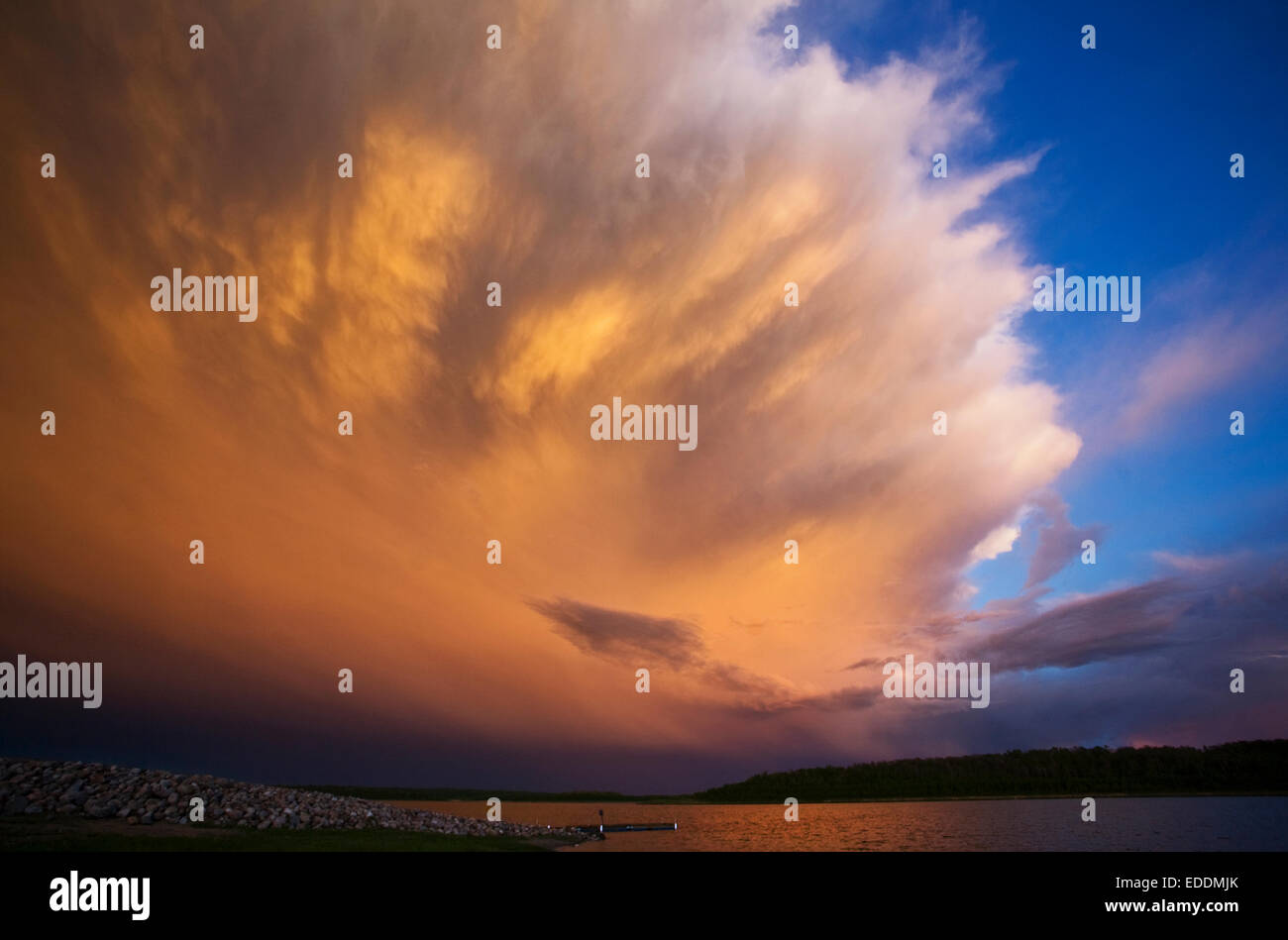 A cloud formation, a storm cloud reflecting sunlight. Stock Photo