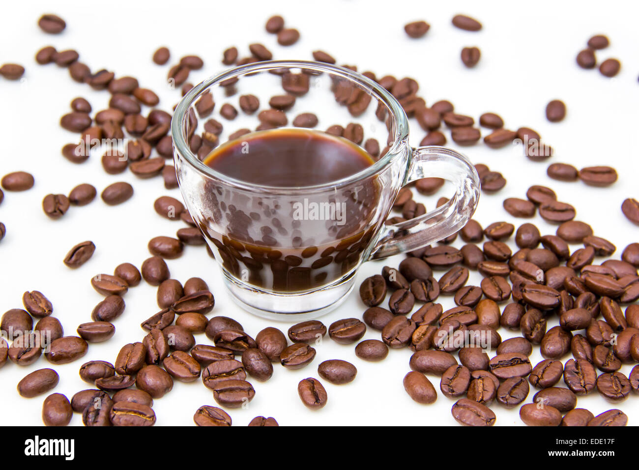 Cup of coffee and coffee beans on white background Stock Photo - Alamy