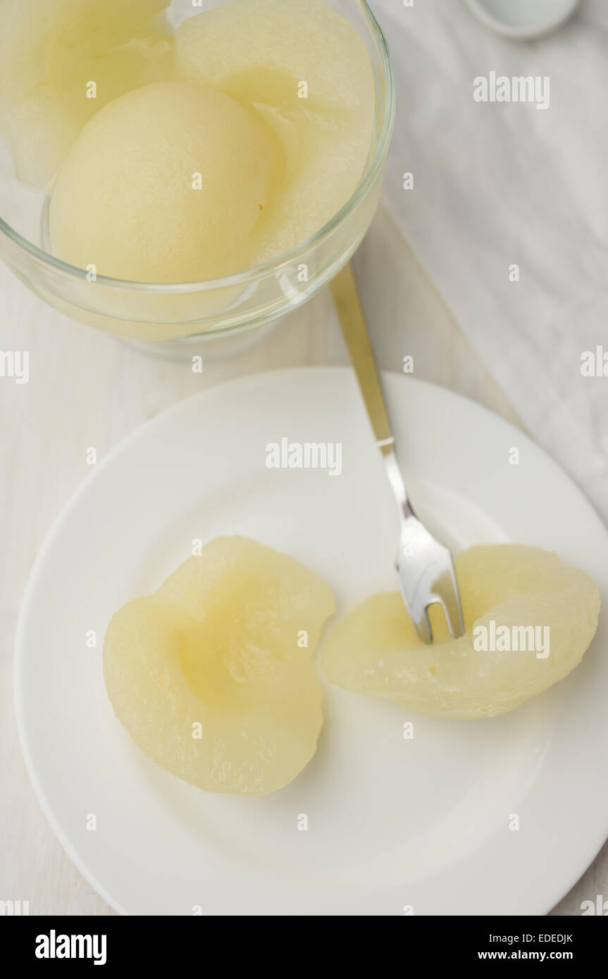 Canned pear dessert on a white plate Stock Photo