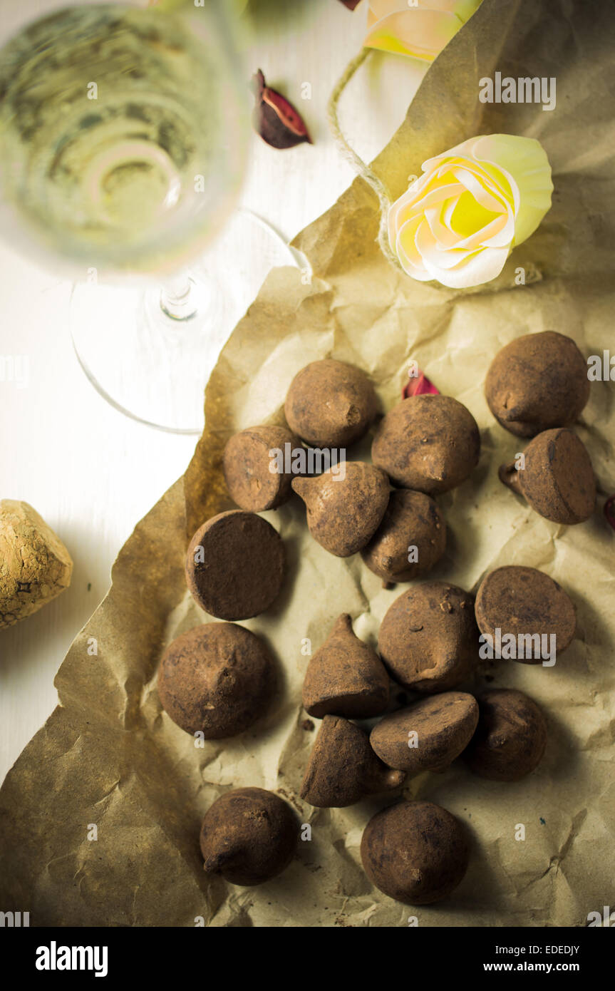 Chocolates truffles and champagne white sparkling wine Stock Photo Alamy