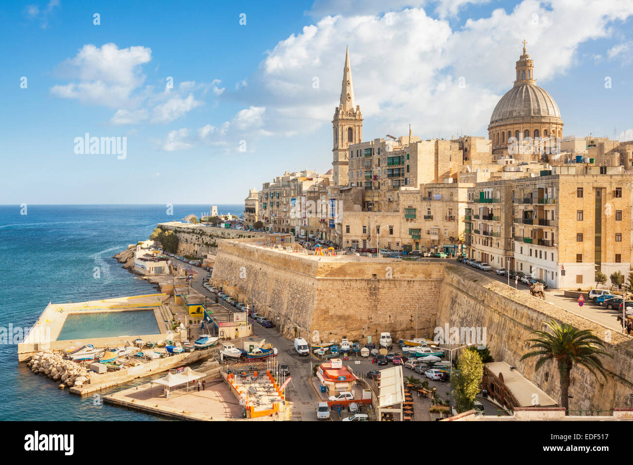 Valletta and Marsamxett Harbour with the Dome of the Carmelite Church and St Pauls Anglican Cathedral Valletta Malta EU Europe Stock Photo