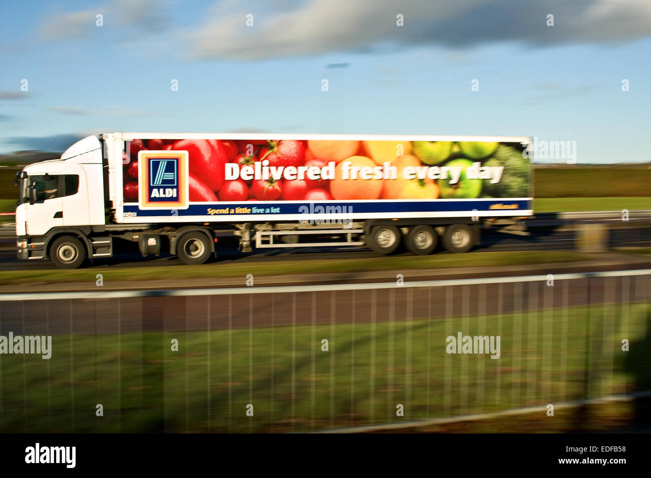 Panning an Aldi articulated lorry with rear sync flash travelling along ...