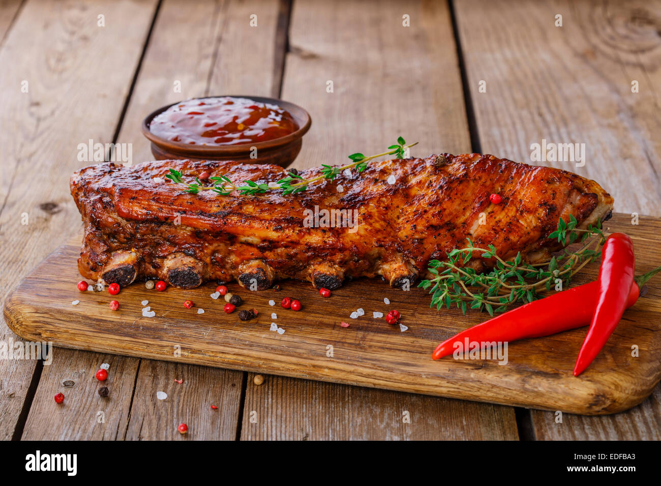 baked pork ribs on a wooden board Stock Photo