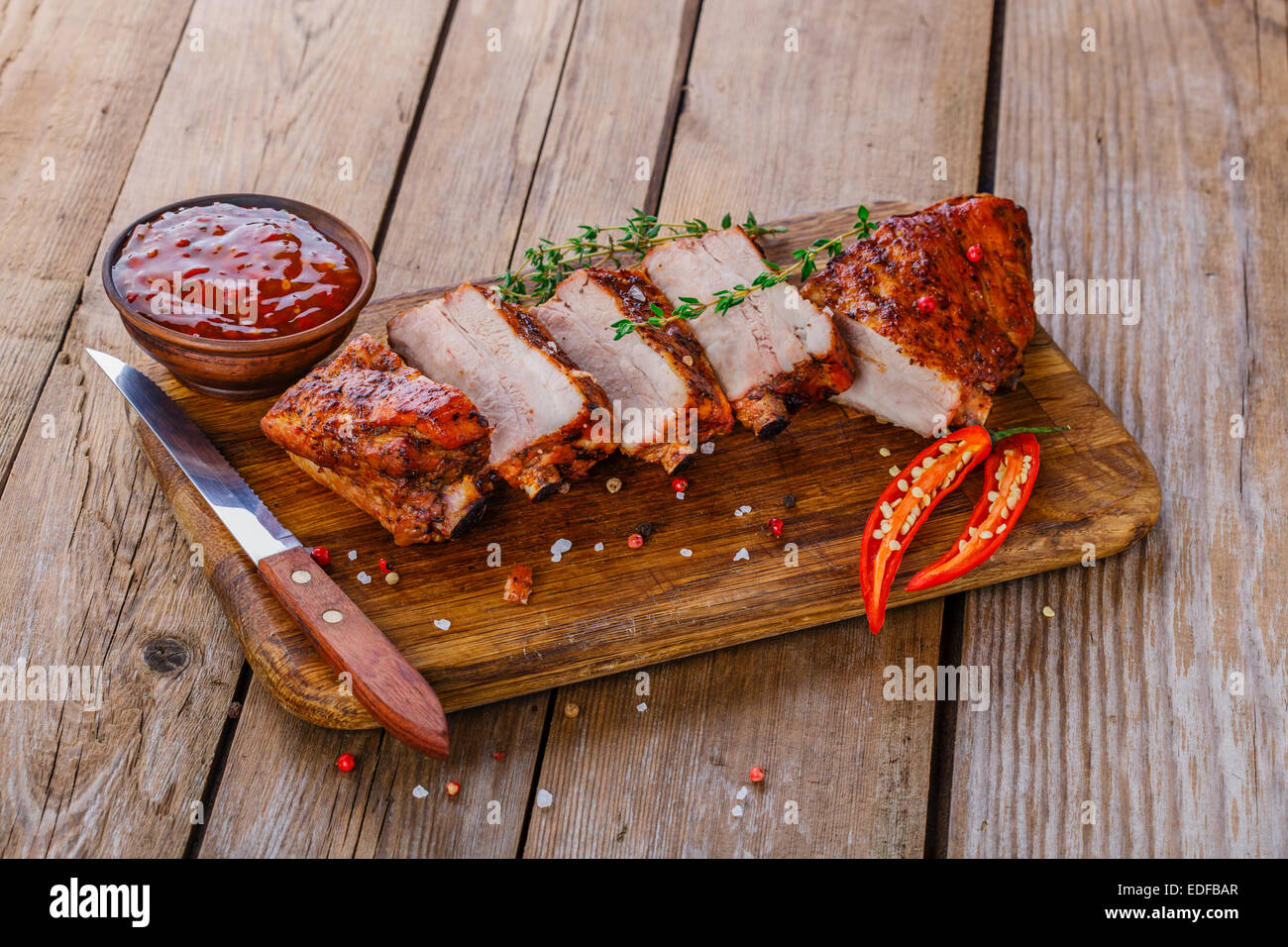 baked pork ribs on a wooden board Stock Photo