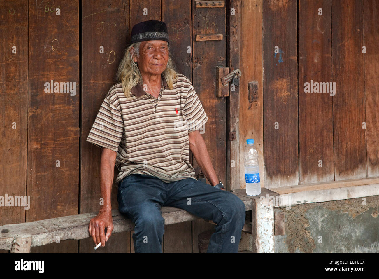 Indonesian elderly man wearing traditional songkok / peci / kopiah in Kota / Old Batavia, Java, Indonesia Stock Photo