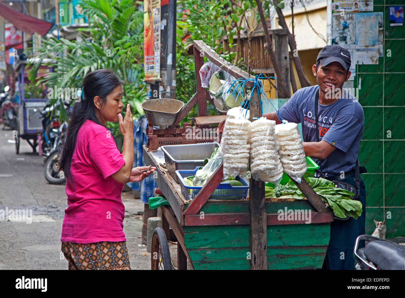Street vendor with cart selling food in the capital city Jakarta, Java, Indonesia Stock Photo