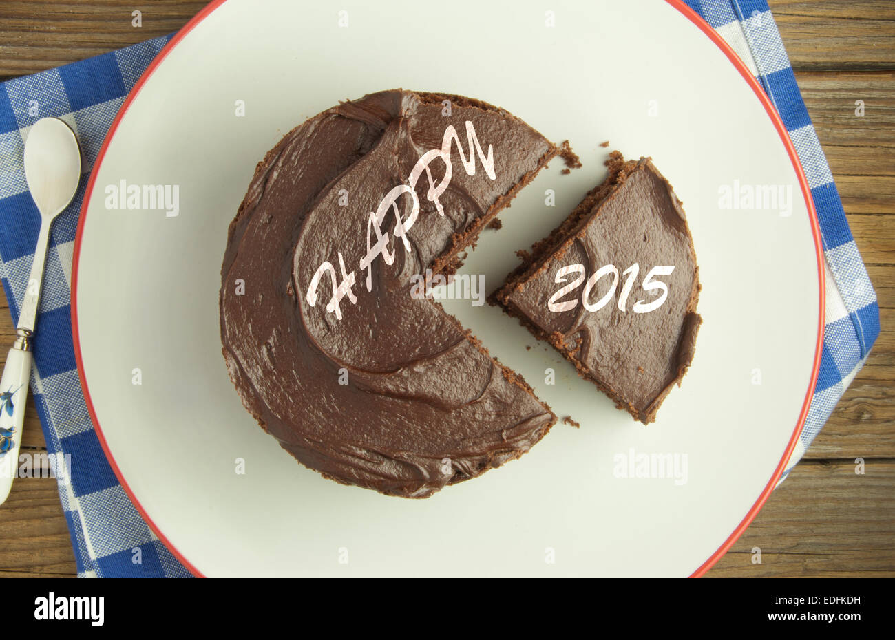 Chocolate covered fudge cake with 2015 new year slice Stock Photo