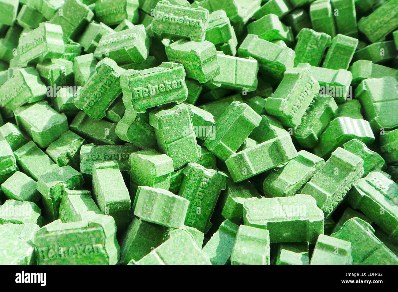 'Green Heineken' Ecstasy pills containing between 200-220mg of MDMA (3,4-methylenedioxy-N-methylamphetamine). Stock Photo