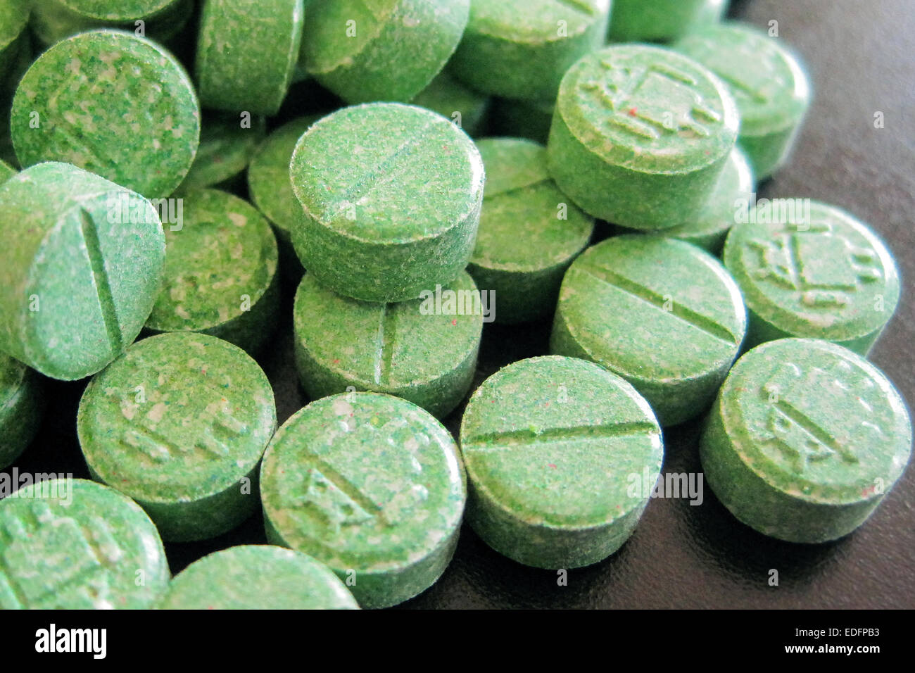 'Green Android' Ecstasy pills containing between 150-200mg of MDMA (3,4-methylenedioxy-N-methylamphetamine). Stock Photo