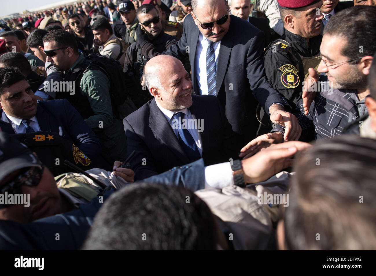 Baghdad, Iraq. 6th Jan, 2015. Iraqi Prime Minister Haider al-Abadi (C ...