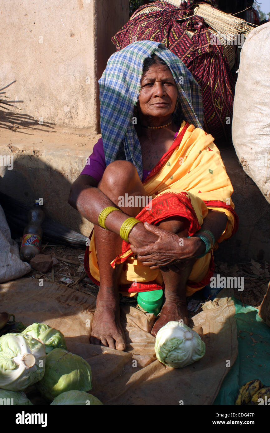 Adivasi woman selling cabbages in Tokapal market, Chhattisgarh, Madyha Pradesh, India Stock Photo