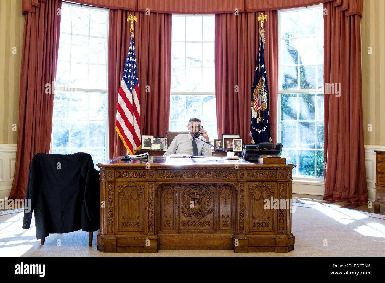 Washington DC, USA. 5th January, 2015. US President Barack Obama talks on the phone with President Beji Caid Essebsi of Tunisia to congratulate him on his victory in Tunisia's first presidential election from the Oval Office of the White House January 5, 2015 in Washington, DC. Credit:  Planetpix/Alamy Live News Stock Photo