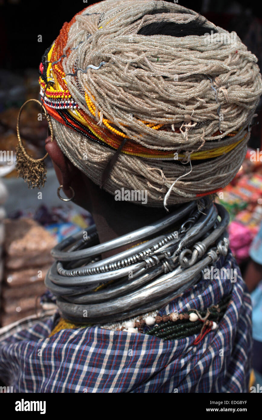 Tribal woman wearing spectacular jewellery in Onkadelli Thursday market, Orissa, India Stock Photo