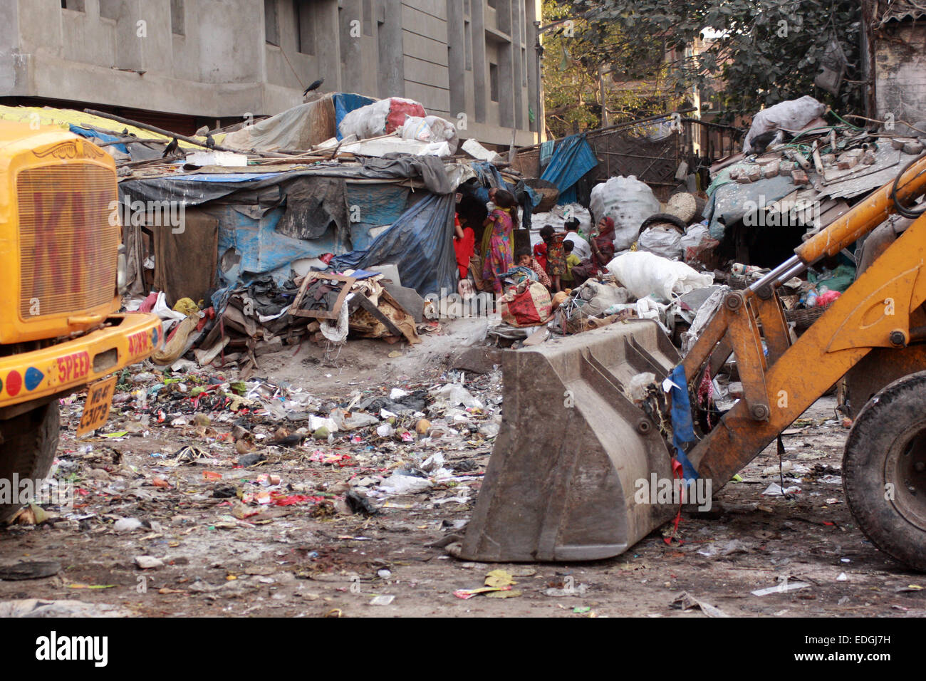 People living on a rubbish tip that is gradually being cleared away, in Old Chinatown district of Kolkata (Calcutta), India Stock Photo